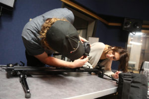 Ball State students Vince Foley and Vanessa Lauby operate a camera on the set of “Amplified: A Conversation with Women in American Film Sound.” Photo by: Laura Huffman