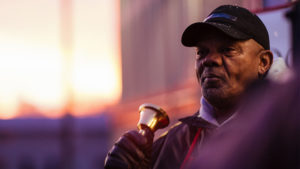 AA Salvation Army volunteer bell ringer. Photo courtesy of Salvation Army USA