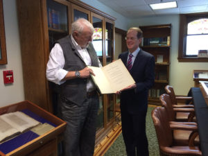 Ball State University President Geoffrey Mearns and Brian Bex display William Blackstone’s “Magna Carta,” which dates to 1759. Photo by: John Carlson