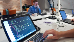 Student entrepreneurs at work in a group office setting. Photo by: graphicstock