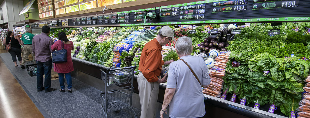 Shoppers check out some of the produce options during opening day. Photo by: Mike Rhodes