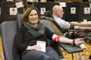 Heidi Reed sits in a donor chair following her blood donation. The day of Heidi's donation, her mother received blood during a surgery. Photo by Amanda Romney/American Red Cross