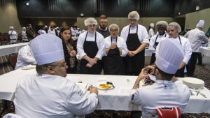 Chef judges provide feedback to students about their entry during the culinary STAR event. Photo by: Mike Rhodes