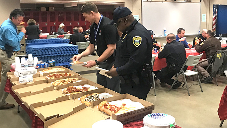 Officers enjoy a free lunch provided by the Ball State Federal Credit Union held at the university police department. Photo provided