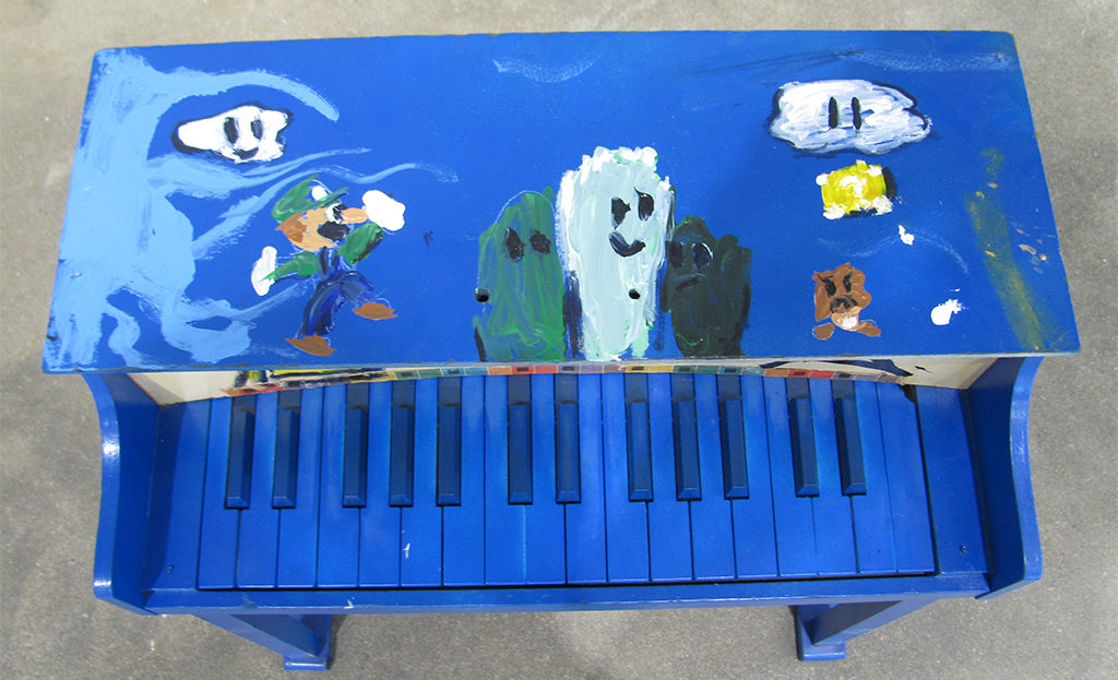 Super Mario Brothers favorite Luigi graces the top of this scene from artist Forrest King's video-game themed piano. Photo provided