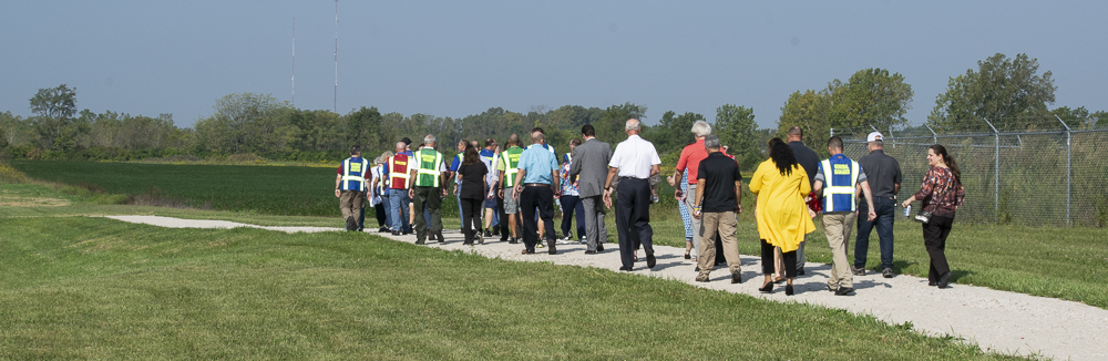 Attendees at the ribbon-cutting were given the opportunity to walk one lap of the track after the formal remarks. Photo by: Mike Rhodes