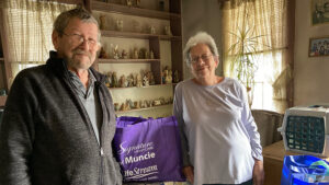 A family is pictured with their AngelWish gift bag from LifeStream Services. Photo provided