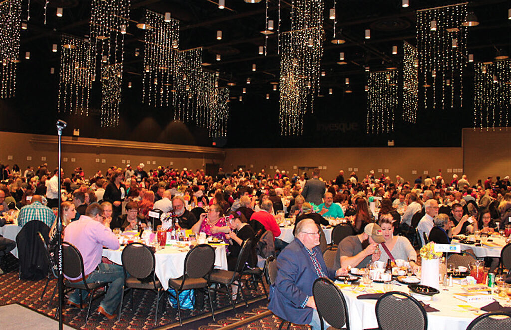 Supporters of the 100 Men Who Cook even dine at the Horizon Convention Center.