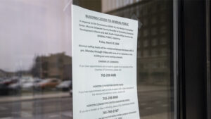 Sign of the times. Affixed to the front door of the Horizon Convention Center. Photo by: Mike Rhodes