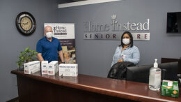Steve Leach, Franchise Manager and Kiara Dunson, Administrative Assistant at Home Instead are pictured with a few boxes of masks supplied by Mayor Ridenour's "Masks for Muncie" project.The company received 1,250 masks. Photo by Mike Rhodes