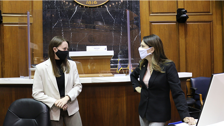 Daleville resident Kayla Skinner (left) discusses legislation with State Rep. Elizabeth Rowray (R-Yorktown) (right) in the House Chamber located at the Statehouse in Indianapolis April 5, 2021. Skinner is interning with the Indiana House of Representatives throughout the 2021 legislative session, assisting representatives and House staff with daily tasks.