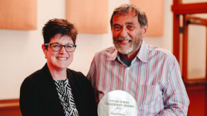 Community Foundation president Kelly K. Shrock presents the Sursa Leadership Award to Greg Huffman for his service to Muncie Civic Theatre. Photo credit M. Hahn Photography.