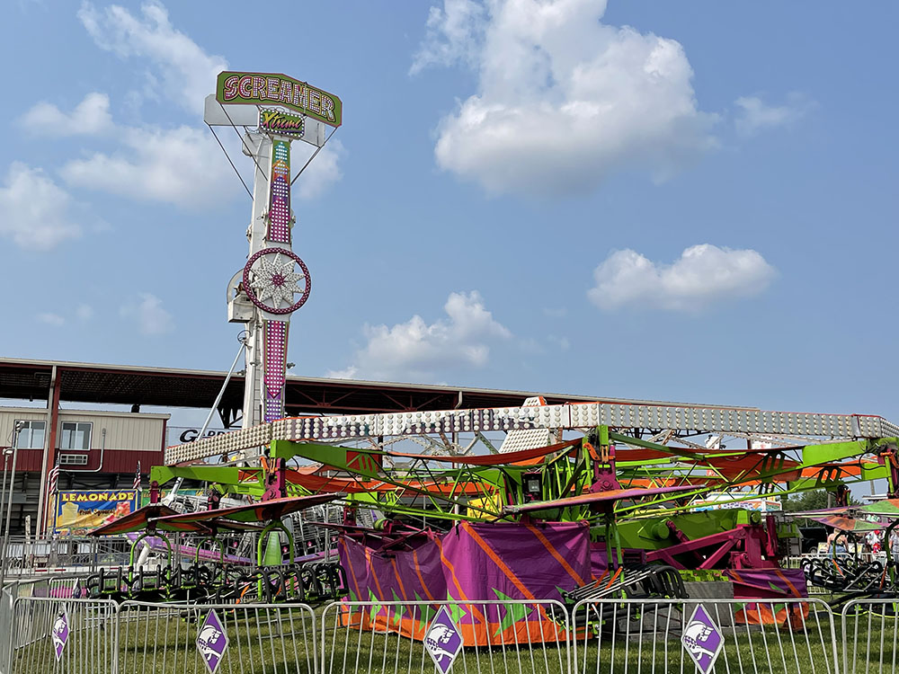 Ultra-colorful fair rides seem to scream “excitement” to potential riders. Photo by Nancy Carlson.