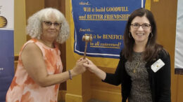 Ana Pichardo passes the gavel to Kate Stoss. Photo by Matt Howell.