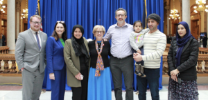 Pictured L-R: Toney Sandleben, Elizabeth Rowray, (R-Yorktown) Bibi Bahrami, Sue Errington, (D-Muncie) and Afghan refugees who have made Indiana their home. Photo provided by Sue Errington.