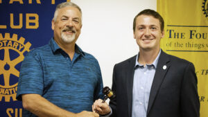 Mark McKinney (Left) is pictured handing the gavel over to new Muncie Sunrise Rotary President, Ben Polk. Photo provided