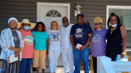 Greater Muncie Habitat for Humanity's 2022 homeowner Charles joined by his brothers and sisters on his front porch. Photo provided by Muncie Habitat for Humanity.