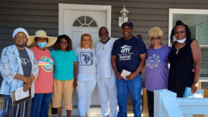 Greater Muncie Habitat for Humanity's 2022 homeowner Charles joined by his brothers and sisters on his front porch. Photo provided by Muncie Habitat for Humanity.