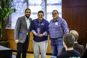 Accepting the Neighborhood Project of the Year Award at the 2022 I.D.E.A. Conference: J.P. Hall, President - Halteman Village Neighborhood Association, Mitch Isaacs, Executive Director - Shafer Leadership Academy, and Brad Polk, Vice President - Halteman Village Neighborhood Association. Photo provided