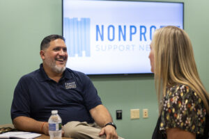 Daniel Gurule, Manager of Donor Relations for The Arc of Indiana Foundation and Erskine Green Training Institute interacts with Mandy Williams, Vice President of Programs at LifeStream Services, Inc., during a peer group meeting in 2022.