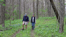 A couple is pictured enjoying the trail at Red-tail’s 2022 Wildflower Celebration. Photo by Elizabeth Ploog