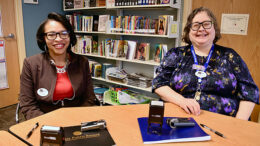 MPL employees Tenisha Harris and Katherine Mitchell with their notary public embossing tools. Photo by Spenser Querry, Muncie Public Library