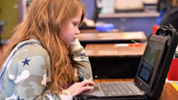 A Grissom Elementary student is pictured using her computer in class. Photo provided