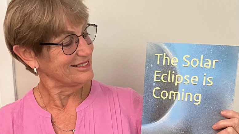 Laurie Lunsford is pictured with her children's book titled "The Solar Eclipse is Coming." Photo provided