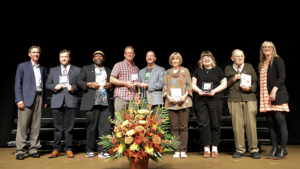 From Left: Mayor Ridenour, Aaron Nicholson, Leon Crosby, Kelsey Timmerman, J.R. Jamison, Carol Burt, Mary Arnette-Delaney, David Dale, Erin Williams (winners not pictured: Janice Shimizu, Rick and Jeanne Zeigler, Lil Jay Jay). Photo by Michelle Heimlich.