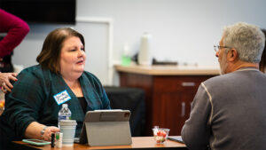 Annette Craycraft, Chair of the Board of Directors of Open Door Health Services, discusses roles and responsibilities with President & CEO Bryan Ayars during a nonprofit program hosted by Shafer Leadership Academy and Nonprofit Support Network. The upcoming All Aboard Workshop on Thursday, November 16, aims to provide education to community members who are interested in board service. Photo provided