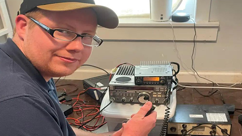 Campbell Reed, President of the Muncie Area Amatuer Radio club is pictured sitting in front of amateur radio equipment. Photo provided