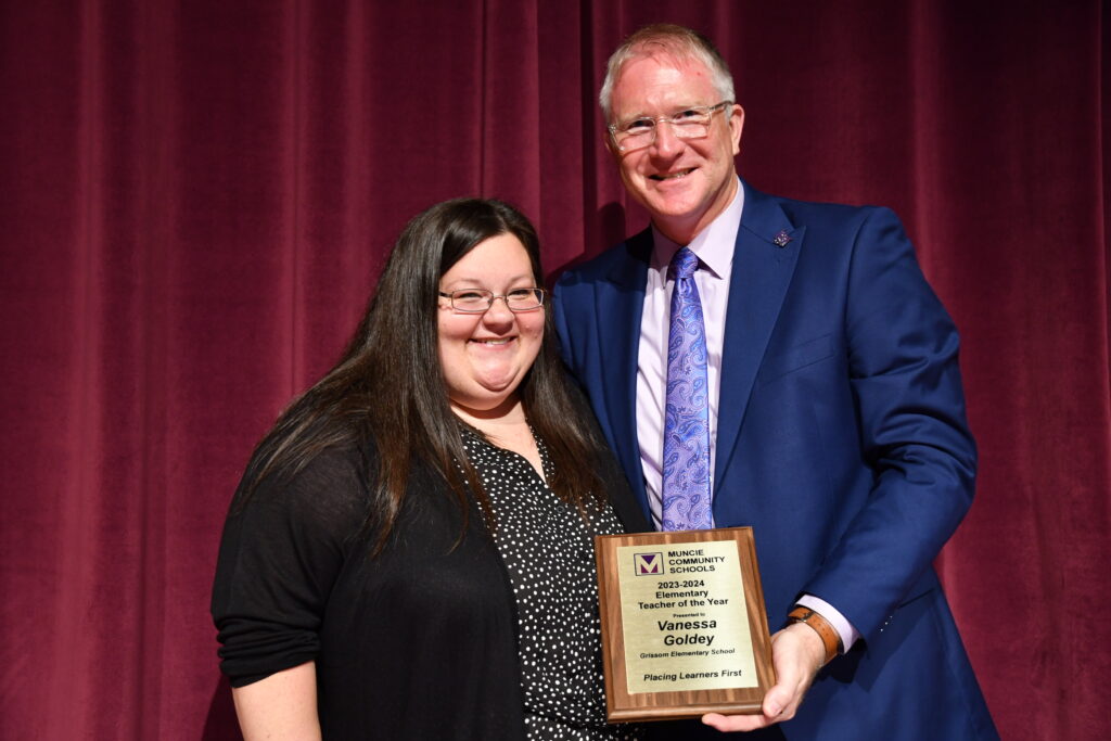 Vanessa Goldey is pictured accepting her award from Dr. Reynolds. Photo provided