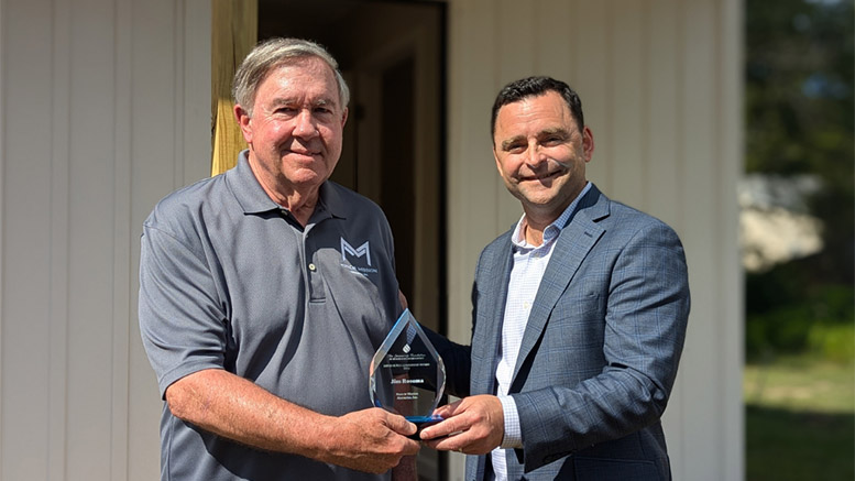 Community Foundation Board Chair Casey Stanley presents the 2024 David Sursa LeadershipAward to Jim Rosema for his service to Muncie Mission during a special presentation on August 20. 2024. Photo provided