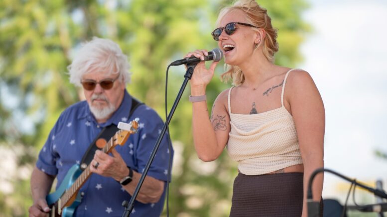 A singer performing at Canan Commons during ArtsWalk, one of many musical events in downtown Muncie. Photo provided