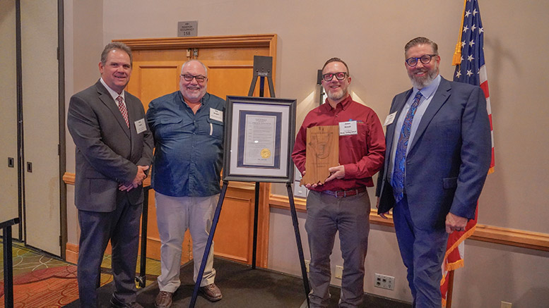 Muncie Sanitary District retired Superintendent of Sanitation Phil Reagon, and current Superintendent Jason Donati accept Governor’s Award from IDEM Assistant Commissioner Bob Lugar and Deputy Assistant Commissioner Carl Wodrich. Pictured from left to right: Bob Lugar, Phil Reagon, Jason Donati, Carl Wodrich.