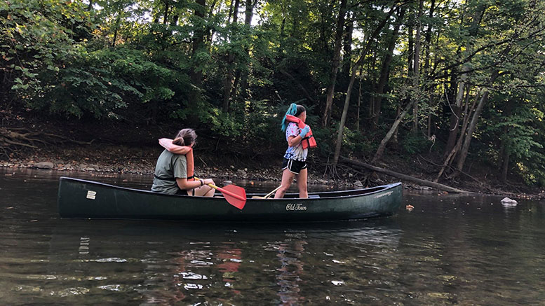 Volunteers use canoes to pull trash out of multiple sections of the White River each year.