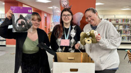 Youth Services employees at Maring-Hunt Library look over recently donated costumes and accessories. All MPL branches will accept costume donations until Friday, October 11. Photo by Spenser Querry, Public Relations Department at Muncie Public Library.