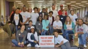 Volunteers of a past food drive gather inside of Muncie Central High School. The high school is one of the sites for this year's food drive and is the place where Thanksgiving Dinners can be received. Photo provided, Feed My Sheep.