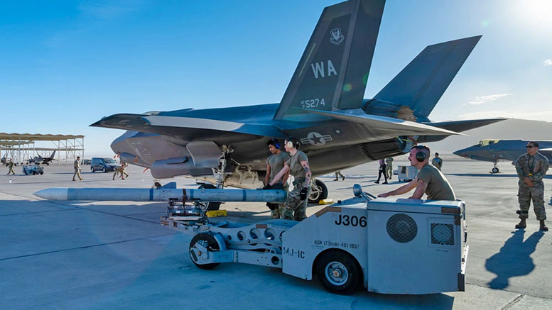 U.S. Airmen assigned to the 57th Aircraft Maintenance Squadron (AMXS) load munitions during a Rapid Aircraft Generation Exercise at Nellis Air Force Base, Nevada, Oct. 28. 2024. The 57th AMXS performs maintenance for F-16 Fighting Falcons and F-35A Lightning II aircraft, including pre- and post- flight inspections, launch and recovery, and munitions loading. U.S. Air Force photo by Airman 1st Class Brianna Vetro