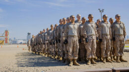 U.S. Marine Corps recruits with Kilo Company, 3rd Recruit Training Battalion, stand at attention before they conduct a Marine Corps Martial Arts Program techniques test at Marine Corps Recruit Depot San Diego, California, Oct. 24, 2024. MCMAP aims to strengthen the mental and moral resiliency of recruits and Marines through realistic combative training, warrior ethos studies, and physical hardening. (U.S. Marine Corps photo by Cpl. Sarah M. Grawcock)