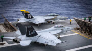 ATLANTIC OCEAN (Sep. 7, 2024) An F/A-18E Super Hornet attached to the “Jolly Rogers” of Strike Fighter Squadron (VFA) 103 sit ready on the flight deck of the world’s largest aircraft carrier, USS Gerald R. Ford (CVN 78), September 8, 2024. USS Gerald R. Ford is underway in the Atlantic Ocean to further develop core unit capabilities during its basic phase of the optimized fleet response plan. U.S. Navy photo by Mass Communication Specialist 2nd Class Maxwell Orlosky.