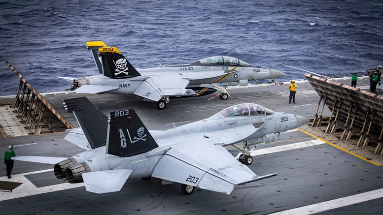 ATLANTIC OCEAN (Sep. 7, 2024) An F/A-18E Super Hornet attached to the “Jolly Rogers” of Strike Fighter Squadron (VFA) 103 sit ready on the flight deck of the world’s largest aircraft carrier, USS Gerald R. Ford (CVN 78), September 8, 2024. USS Gerald R. Ford is underway in the Atlantic Ocean to further develop core unit capabilities during its basic phase of the optimized fleet response plan. U.S. Navy photo by Mass Communication Specialist 2nd Class Maxwell Orlosky.