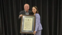 Kelly Stanley is pictured next to State Representative Elizabeth Roway and the Sagamore of the Wabash award.