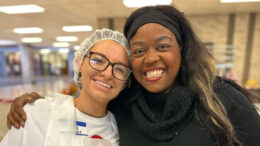 Feed My Sheep chair Jeannine Ferrer stands with her daughter-in-law and volunteer Courtney Lake at a Thanksgiving food drive at Muncie Central High School. Lake volunteered multiple times for Feed My Sheep. Photo provided by Feed My Sheep.