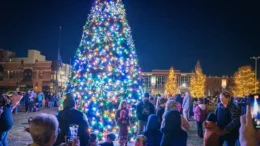 Families gather around the animated, musical holiday tree at Light Up DWNTWN in Canan Commons. Photo provided.