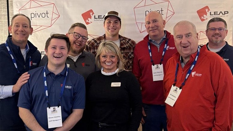 Pro QB Riley Leonard (wearing the plaid shirt) and the Leap Managed IT Team. Photo provided.